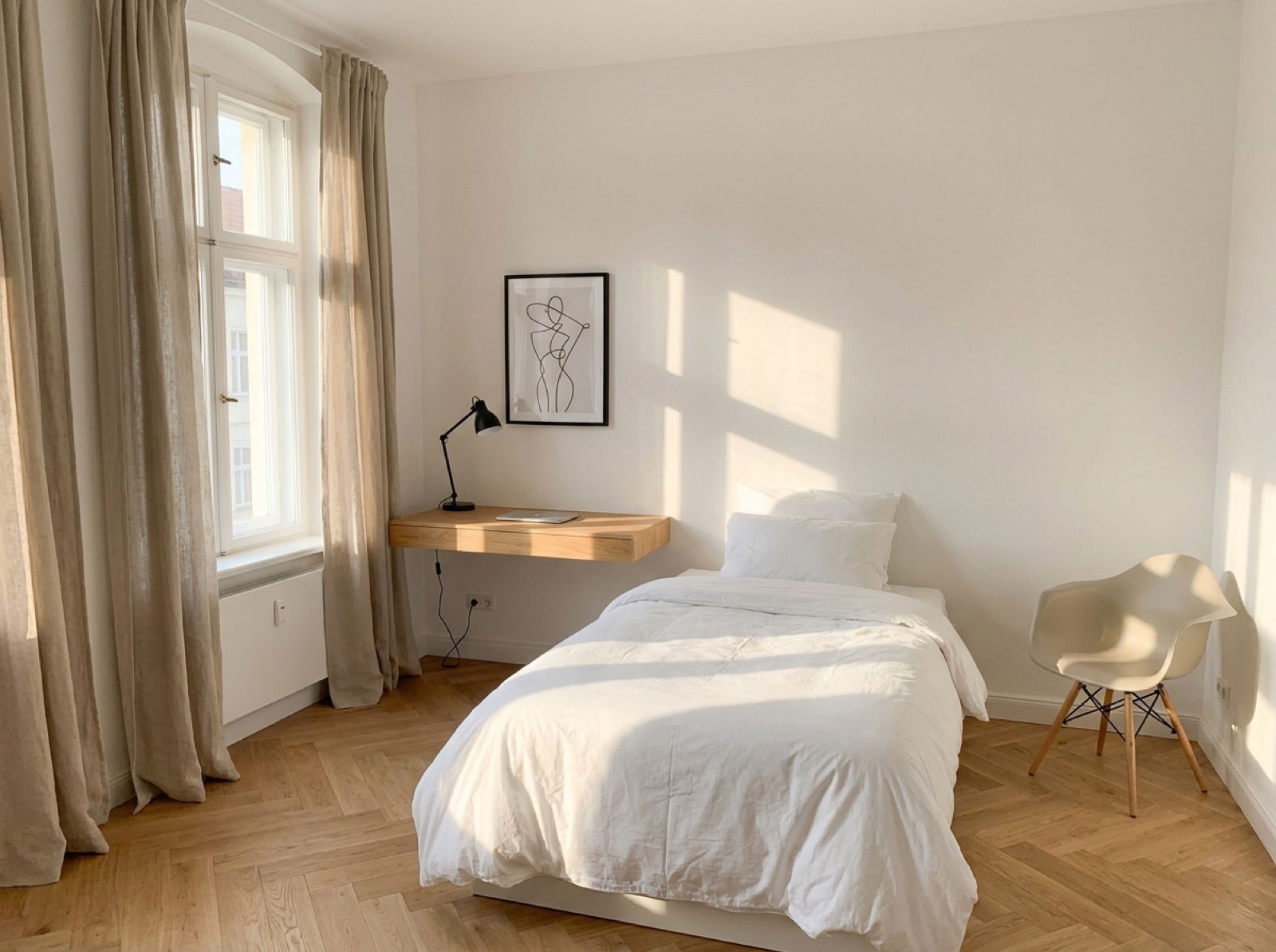 Studio Room — balanced and clean layout with desk, bed, and single accent chair